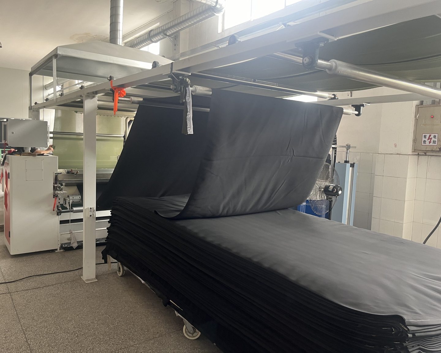 Laminating line in the partner plant, with laminated neoprene stacked at the output end